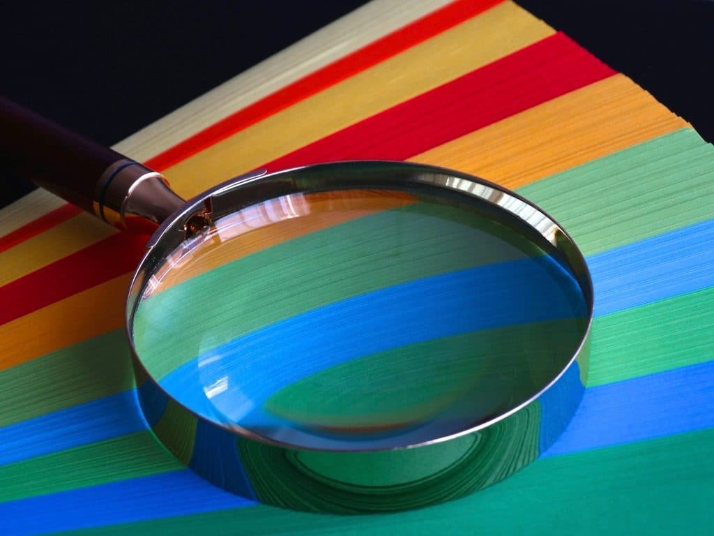 Seeking the truth in reviews, magnifying glass examining details